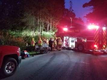 Emergency crews respond to Rogers Rd. in Aylmer following a farm tractor rollover, August 28, 2018. (Photo courtesy of the OPP)