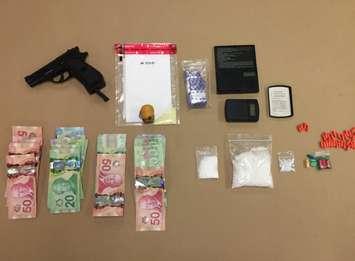 St. Thomas police seized a quantity of crystal methamphetamine, hydromorphone pills, and a replica gun after a traffic stop, March 9, 2017. Photo courtesy of St. Thomas police.