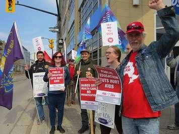 Members and supporters of the London and District Labour Council rally outside of the local Ontario Ministries of Labour and Education at 217 York Street, April 17, 2019. (Photo by Miranda Chant, Blackburn News)