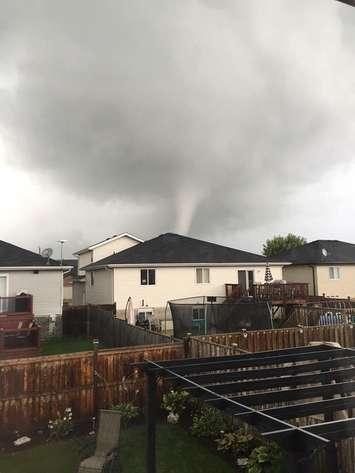 A local resident snapped a photo of a funnel cloud that formed near Victory St. in LaSalle, August 24, 2016. (Photo courtesy of Cody Crease via Twitter)