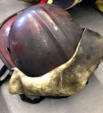 A helmet worn by a London firefighter that is nearly melted after a fire on Clarence St. in London, February 7, 2015. (Photo courtesy of the London Professional Fire Fighters Association via Facebook)