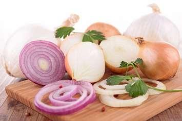 Raw onions. File photo courtesy of © Can Stock Photo / margouillat