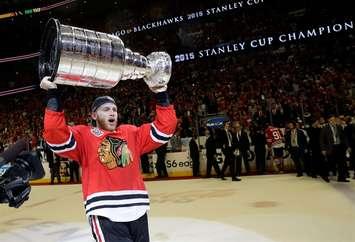 FILE - In this June 15, 2015, file photo, Chicago Blackhawks right wing Patrick Kane celebrates after defeating the Tampa Bay Lightning in Game 6 of the NHL hockey Stanley Cup Final series in Chicago. The NHL says it is "following developments" of a police investigation involving Chicago Blackhawks star Patrick Kane, Thursday, Aug. 6, 2015. (AP Photo/Nam Y. Huh, File)