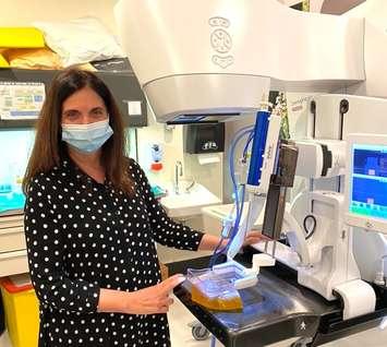 Dr. Anat Kornecki with a biopsy machine. Photo courtesy of Lawson Health Research Institute.