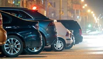 Vehicles parked along a street. File photo courtesy of © Can Stock Photo / Bilanol