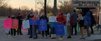 Protesters gather across the street from Lambton Kent Composite School. December 17, 2018. (Submitted photo)
